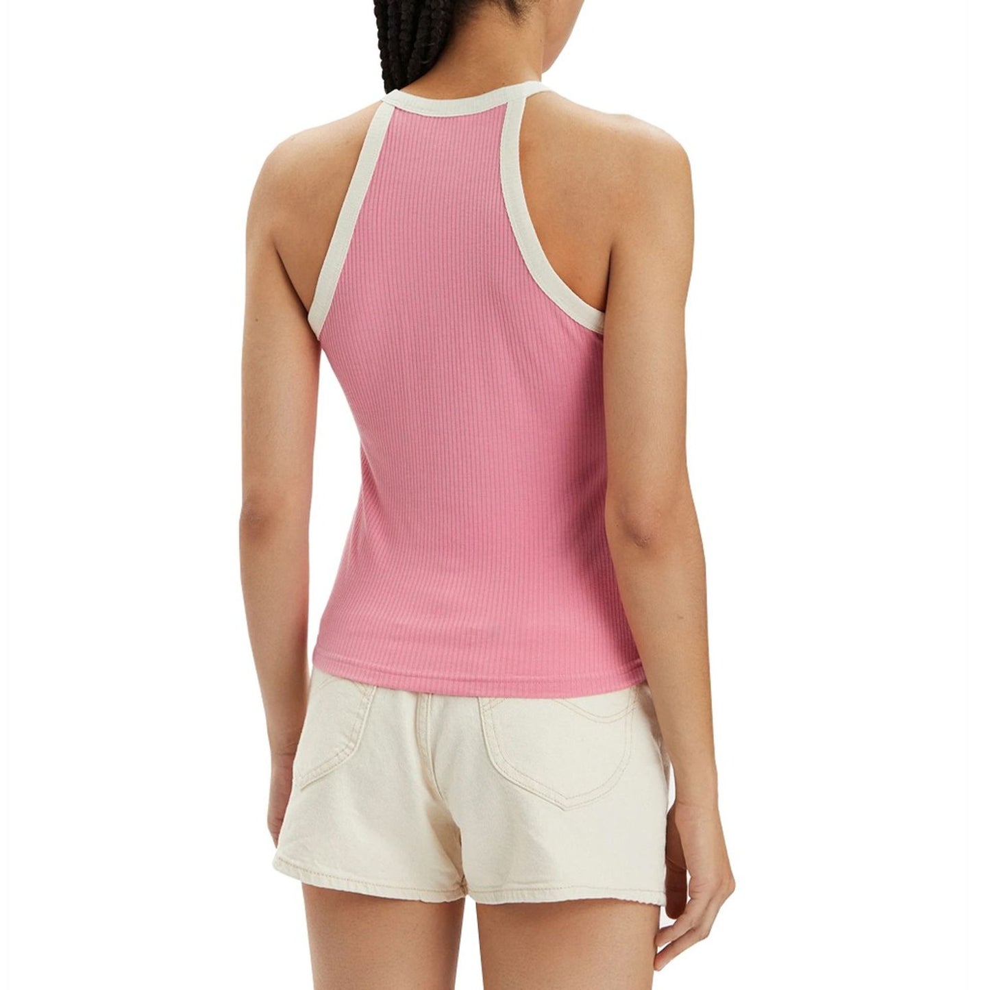 Back view of a woman wearing a pink ribbed top with white trim, showcasing women's Lee tops style.