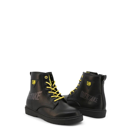 Shone fall winter ankle boots in black with yellow laces and OVERTAKE graphic for kids.