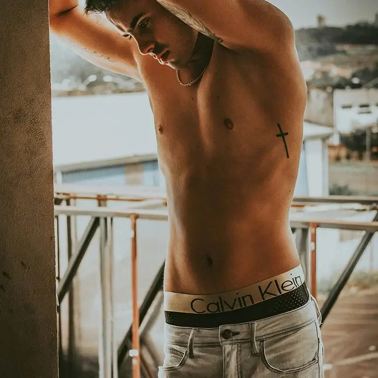 Stylish comfortable men underwear showcased by a model in casual setting, highlighting the brand Calvin Klein.