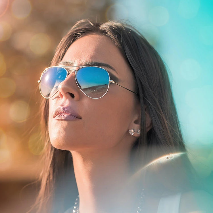 Woman wearing stylish sunglasses in a sunny setting for Women accessories collection.