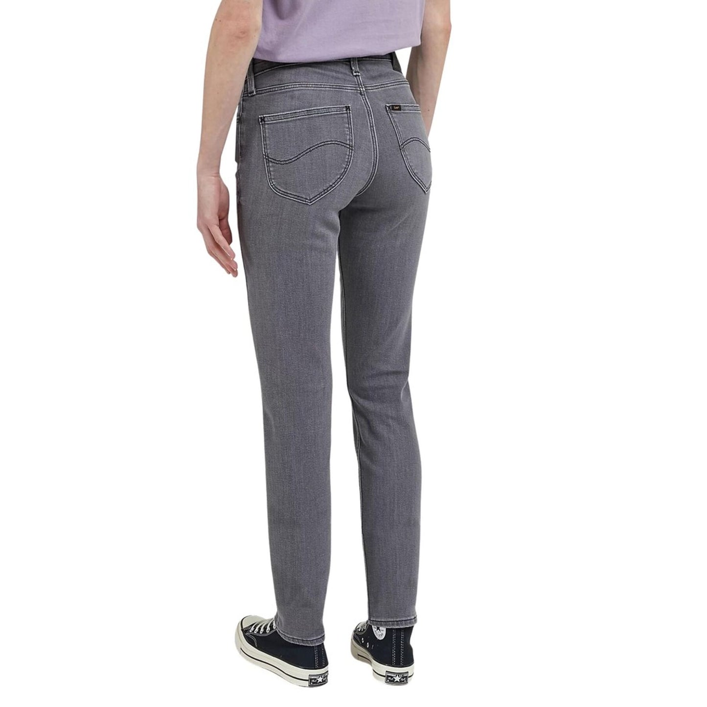 Woman wearing gray Lee women jeans, showcasing the back design and fit