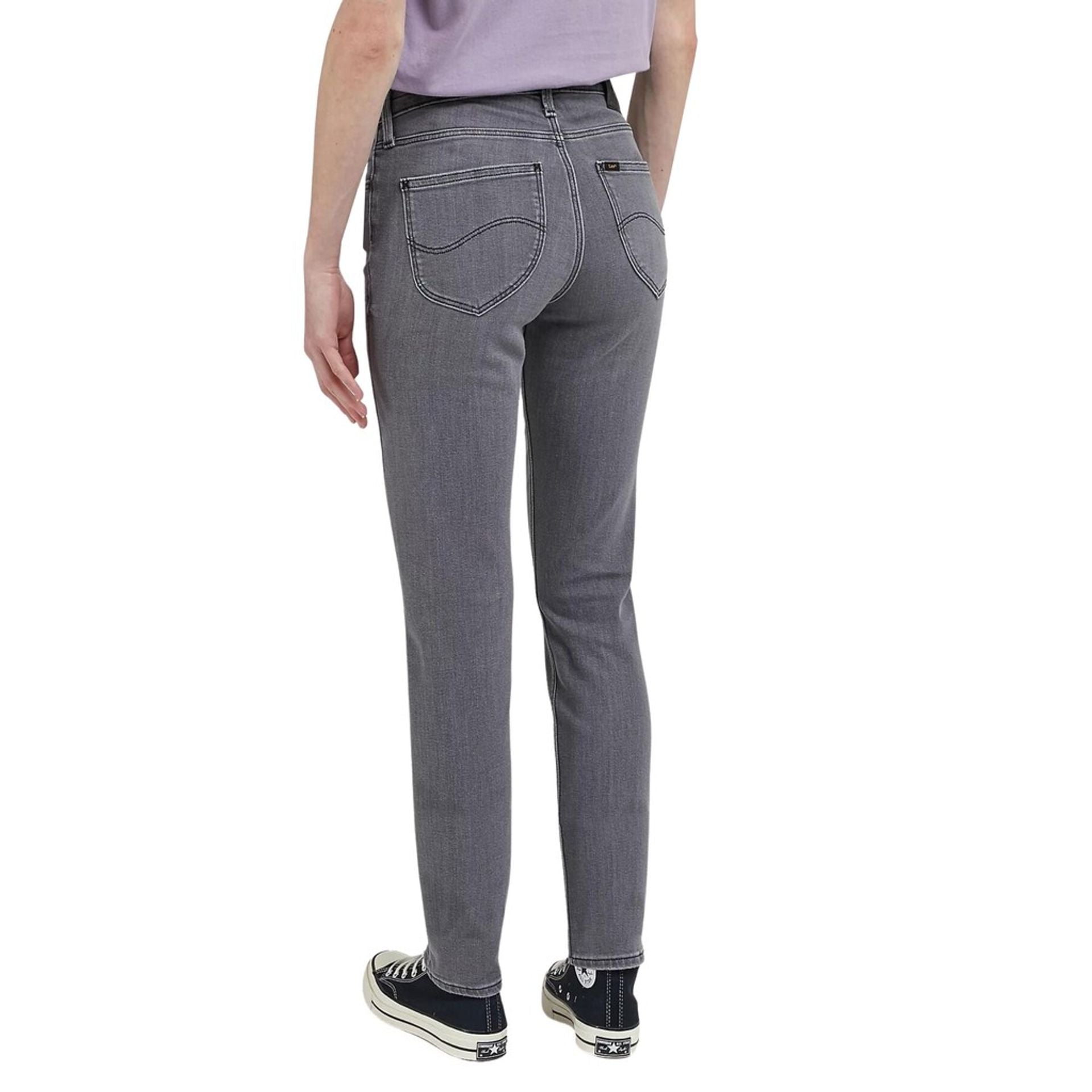 Woman wearing gray Lee women jeans, showcasing the back design and fit