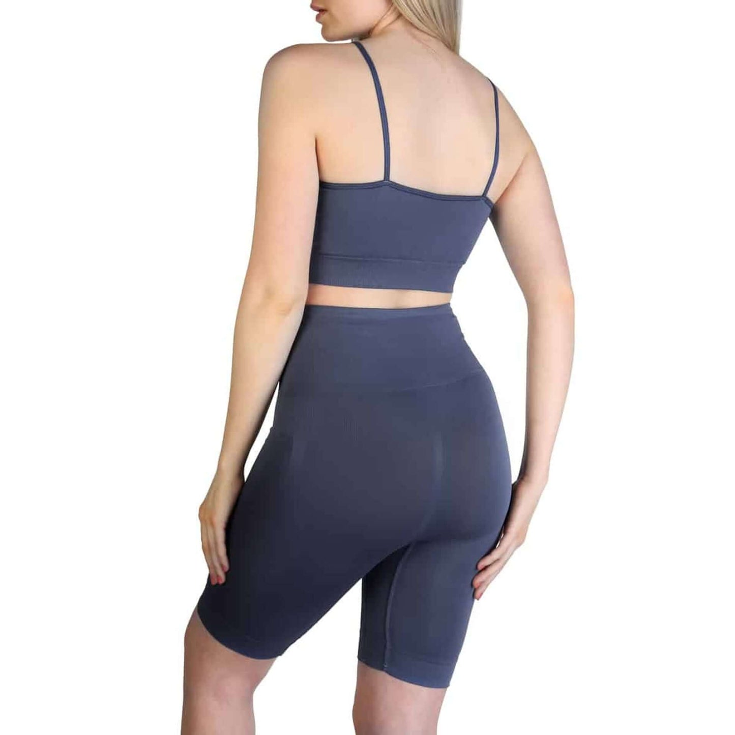 Woman wearing Bodyboo Shaping underwear, showing back view of shaping shorts and fitted top in gray.